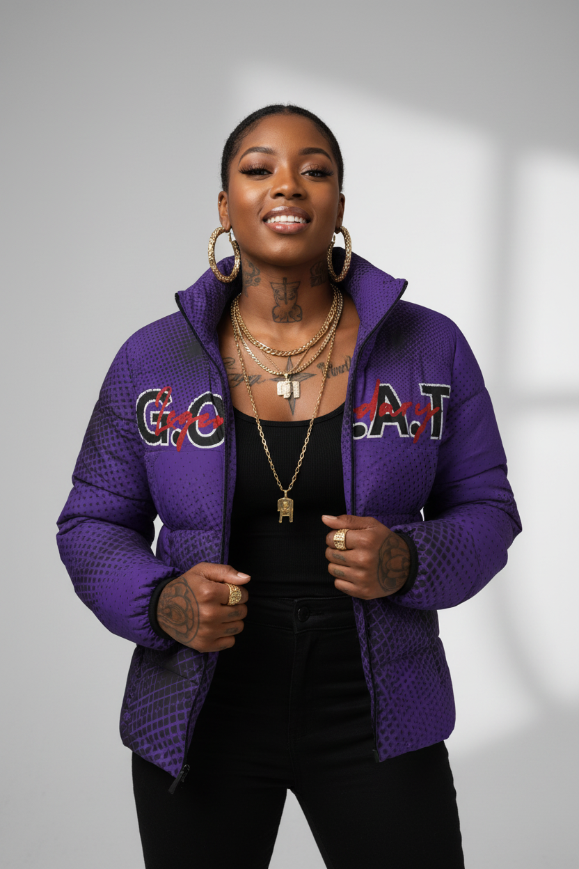 Young African woman with jewelry and tattoos wearing open purple GOAT puffer jacket